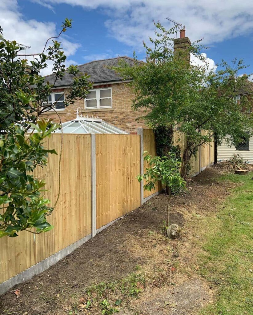 This is a photo of fence panels installed in a residential garden using concrete posts and gravel boards. Installed by Fast Fix Fencing Bowthorpe